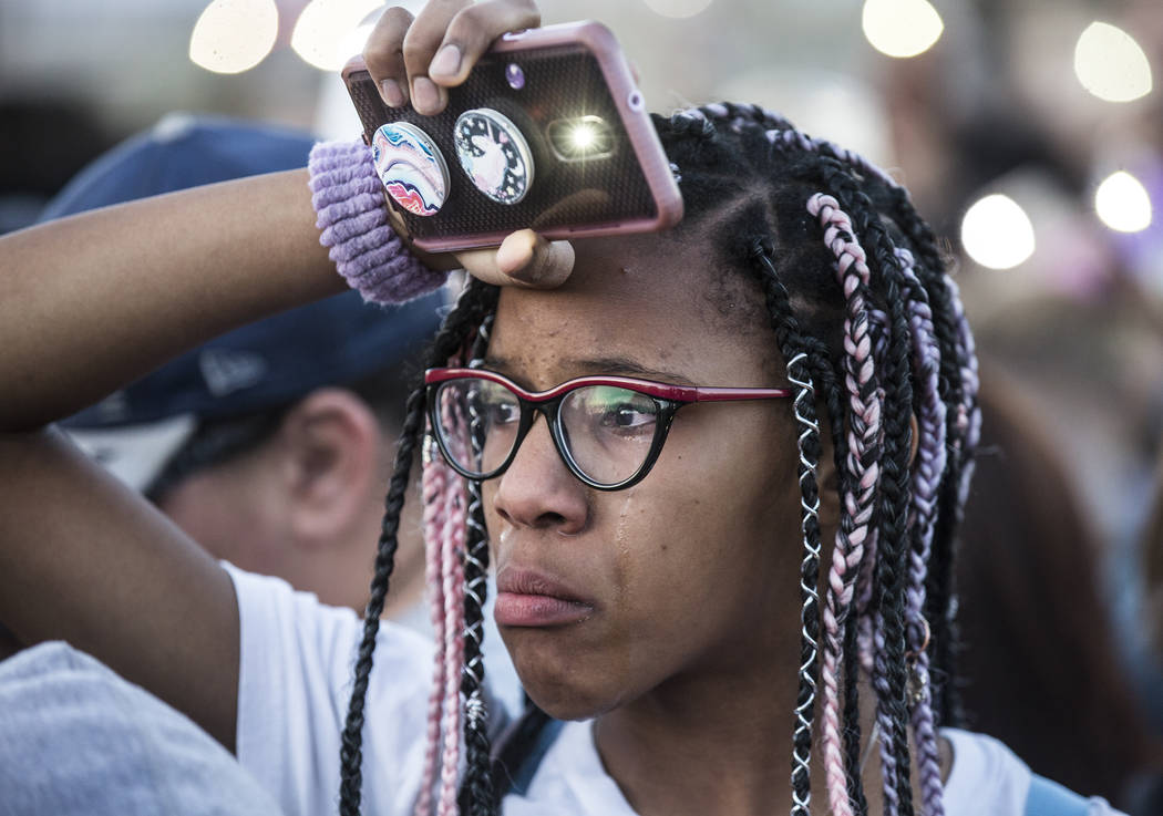 Friends and family mourn the loss of Jonathan Smith, 12, during a vigil for Smith at Wilbur &am ...