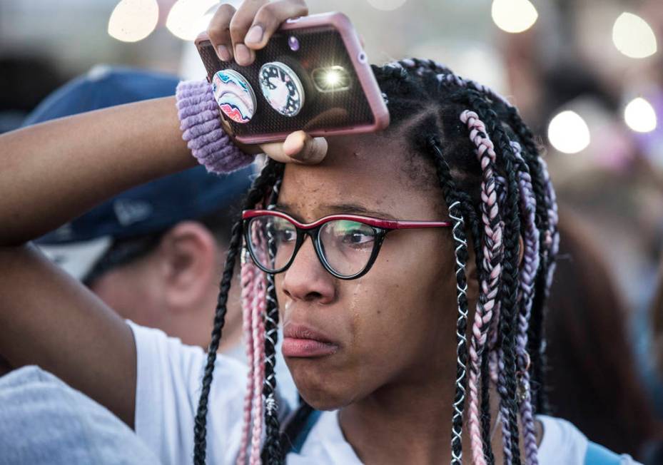 Friends and family mourn the loss of Jonathan Smith, 12, during a vigil for Smith at Wilbur &am ...