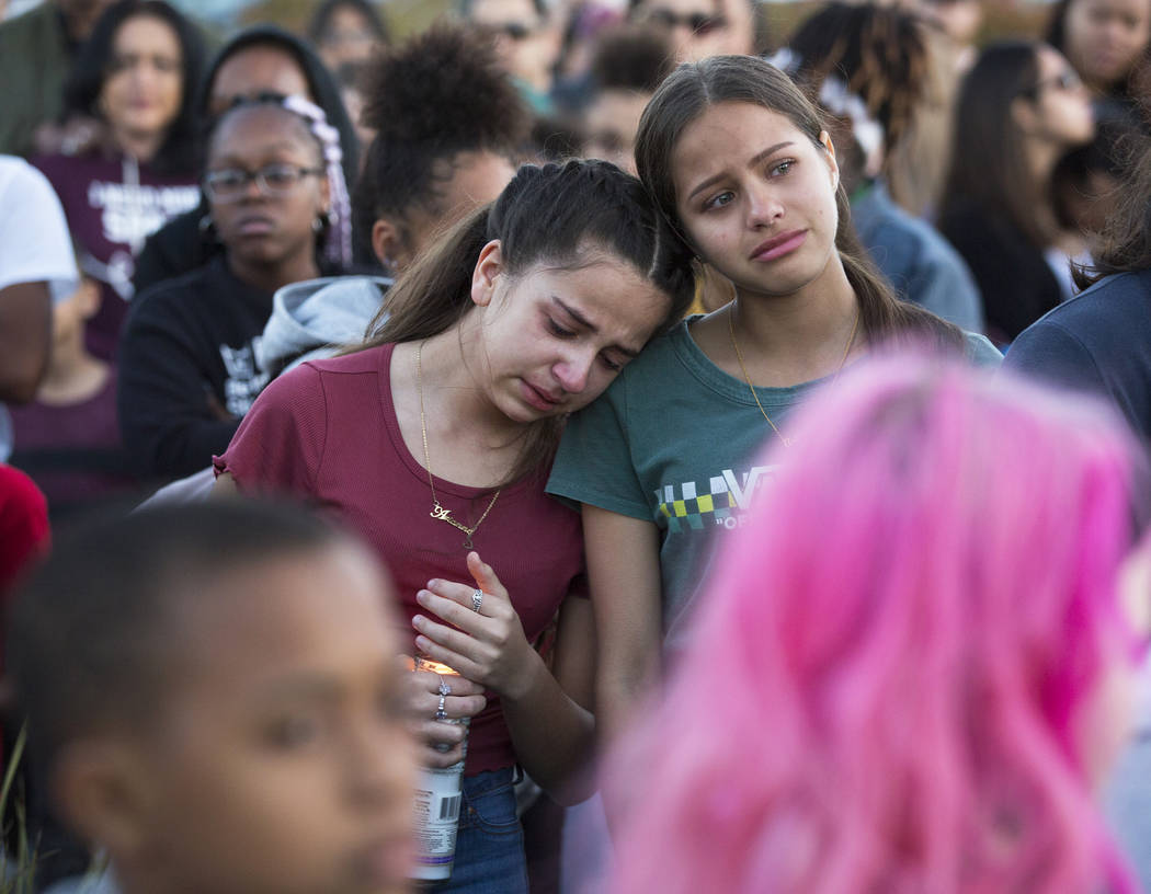 Friends and family mourn the loss of Jonathan Smith, 12, during a vigil for Smith at Wilbur &am ...