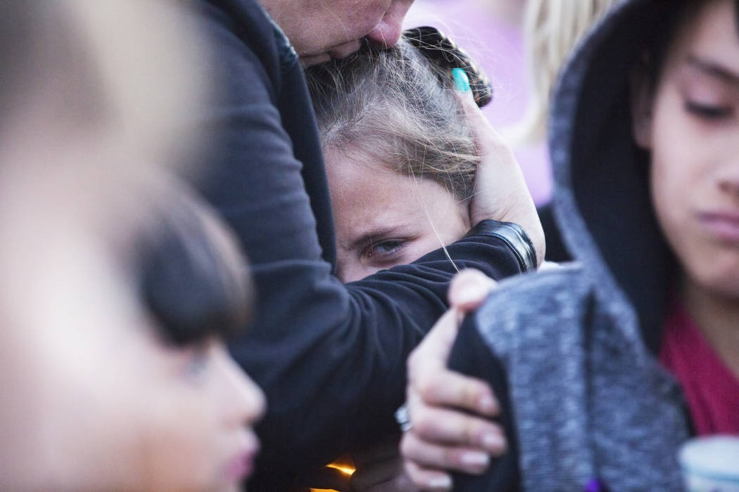 Friends and family mourn the loss of Jonathan Smith, 12, during a vigil for Smith at Wilbur &am ...