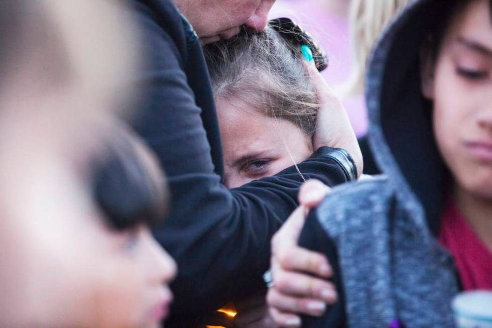 Friends and family mourn the loss of Jonathan Smith, 12, during a vigil for Smith at Wilbur &am ...