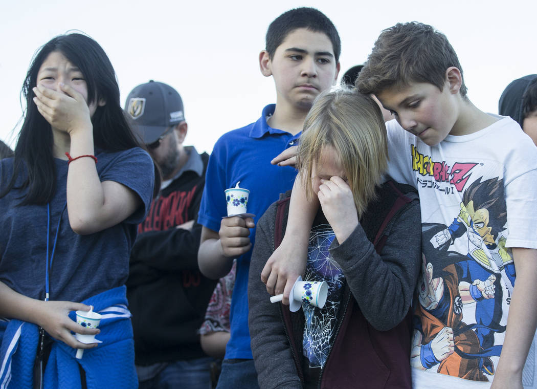 Friends and family mourn the loss of Jonathan Smith, 12, during a vigil for Smith at Wilbur &am ...