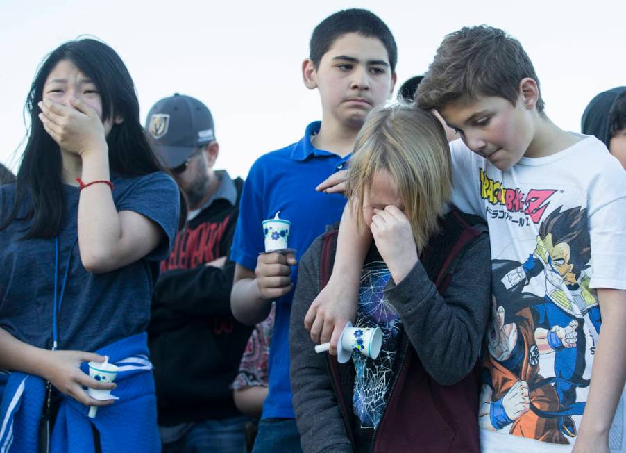 Friends and family mourn the loss of Jonathan Smith, 12, during a vigil for Smith at Wilbur &am ...