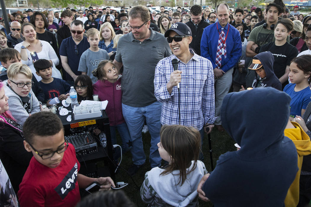 Family friend Mike Mahayosnand, right, shares a light-hearted story about Jonathan Smith, 12, d ...