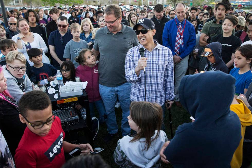 Family friend Mike Mahayosnand, right, shares a light-hearted story about Jonathan Smith, 12, d ...