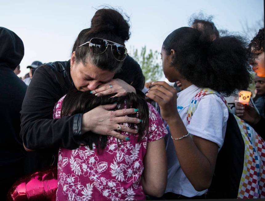 Friends and family mourn the loss of Jonathan Smith, 12, during a vigil for Smith at Wilbur &am ...