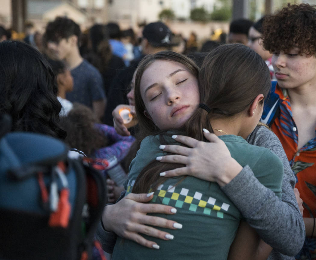 Friends and family mourn the loss of Jonathan Smith, 12, during a vigil for Smith at Wilbur &am ...