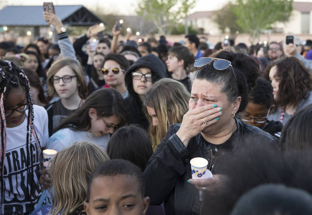 Friends and family mourn the loss of Jonathan Smith, 12, during a vigil for Smith at Wilbur &am ...