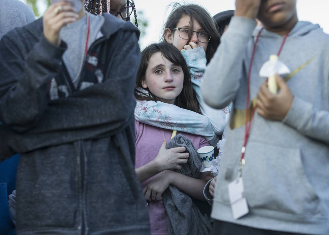 Friends and family mourn the loss of Jonathan Smith, 12, during a vigil for Smith at Wilbur &am ...