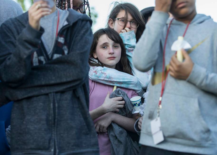 Friends and family mourn the loss of Jonathan Smith, 12, during a vigil for Smith at Wilbur &am ...