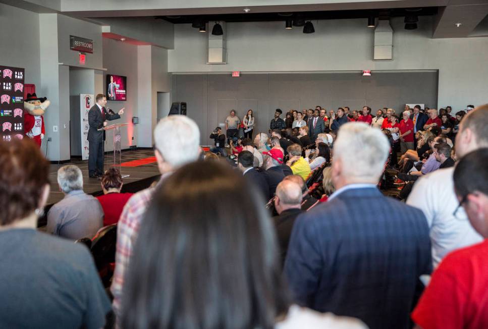 New UNLV men's basketball coach T.J. Otzelberger, left/top, addresses the crowd at the Strip Vi ...