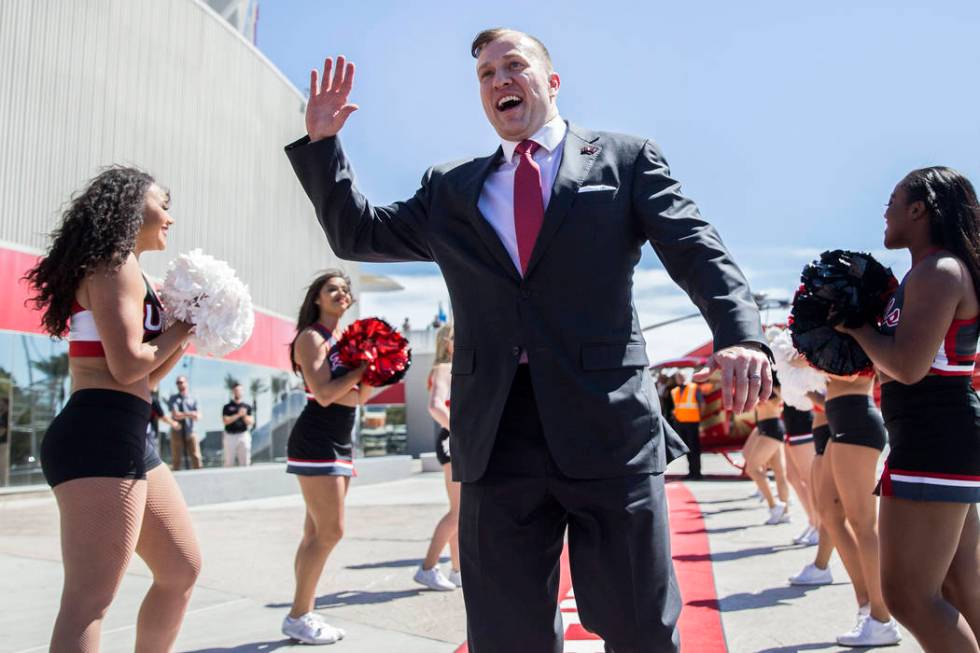 New UNLV men's basketball coach T.J. Otzelberger waves to fans outside the Thomas & Mack Ce ...