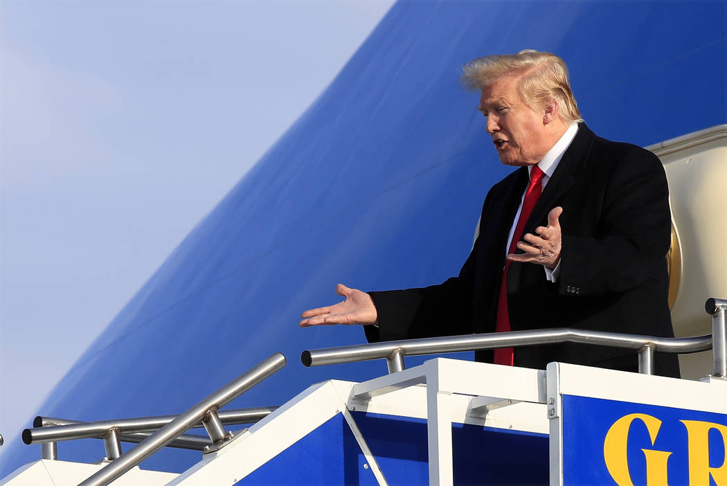 President Donald Trump arrives at Gerald R. Ford International Airport in Grand Rapids, Mich., ...