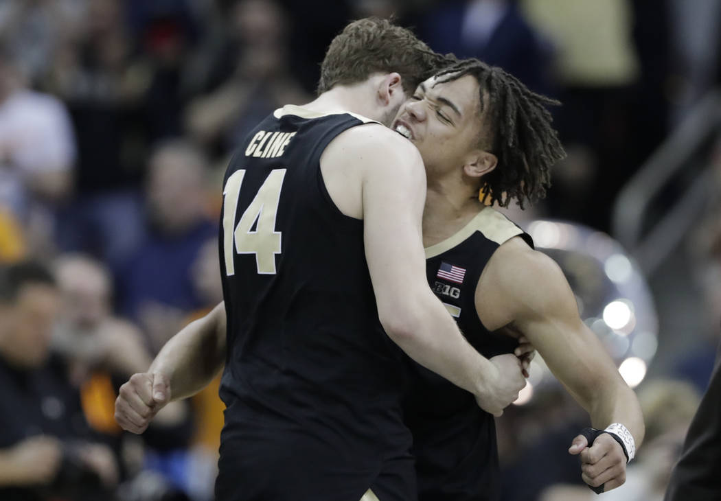 Purdue's Ryan Cline (14) and Carsen Edwards celebrate after defeating Tennessee 99-94 in overti ...