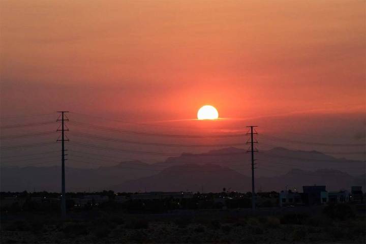 The sun rises over Summerlin on Friday, Aug. 3, 2018. Ozone season 2019 begins Monday. (Max Mic ...