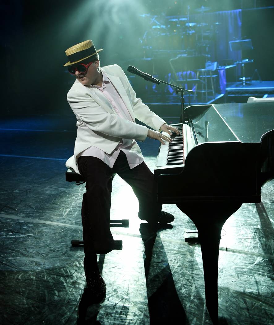 Greg Ransom portrays Elton John in "The Greatest Piano Men" at Flamingo Las Vegas. (Denise Trus ...