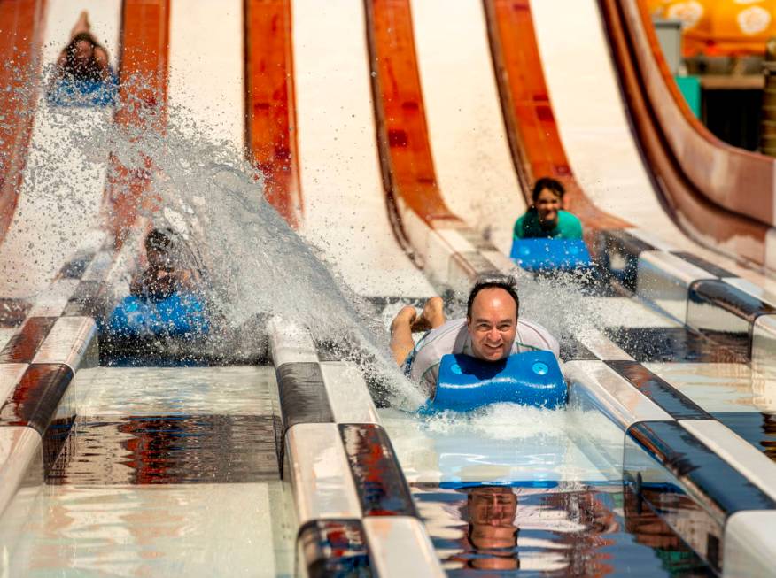 Dave Smith of Victoria, British Columbia, splashes his son Matthew, 16, as the family comes dow ...