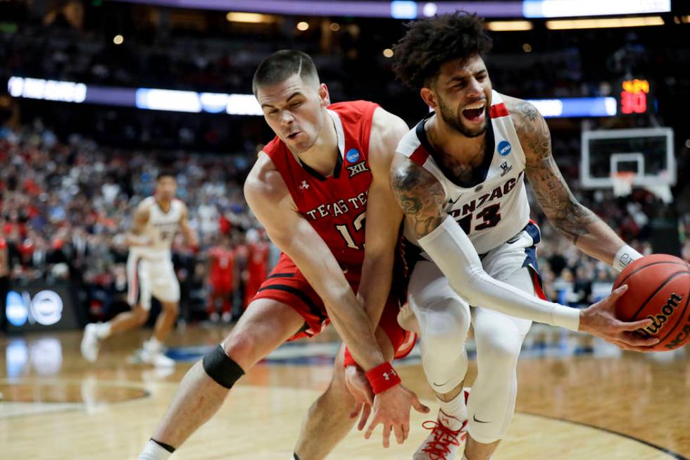 Gonzaga guard Josh Perkins, right, pulls the ball away from Texas Tech guard Matt Mooney during ...