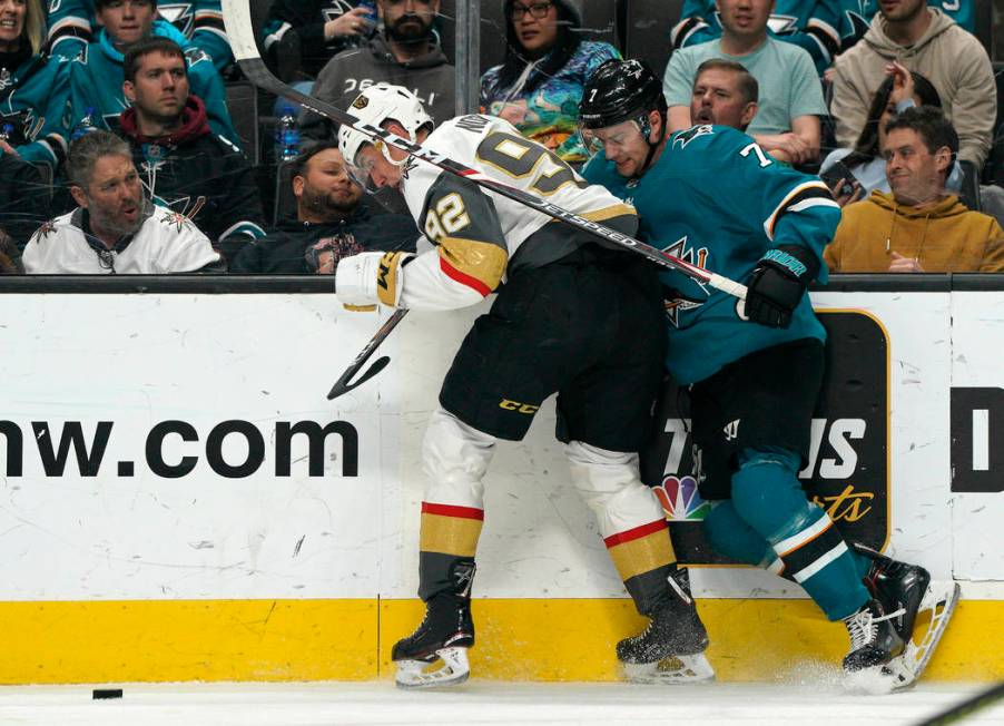 Vegas Golden Knights left wing Tomas Nosek, left, battles against the boards with San Jose Shar ...