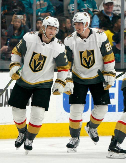 Vegas Golden Knights center William Karlsson (71) is congratulated by teammate Nick Holden (22) ...