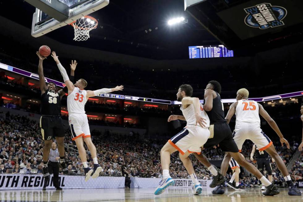 Purdue's Trevion Williams (50) puts up a shot against Virginia's Jack Salt (33) during the seco ...