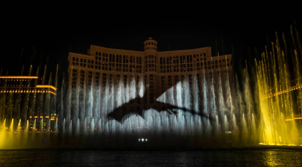 A dragon arrives during the debut of the new water show based on "Game of Thrones" at ...