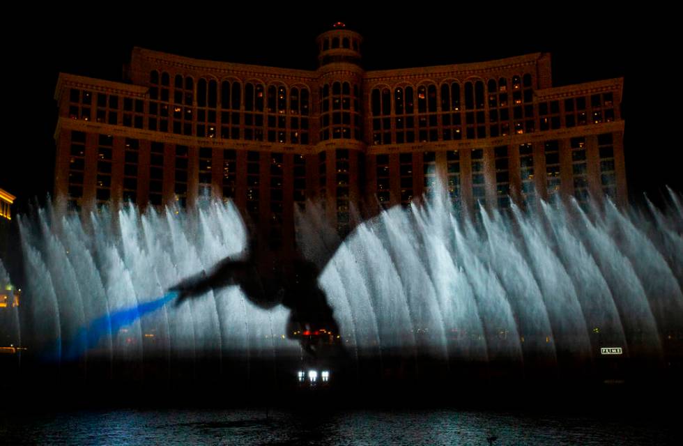 A dragon breathes fire during the debut of the new water show based on "Game of Thrones&qu ...