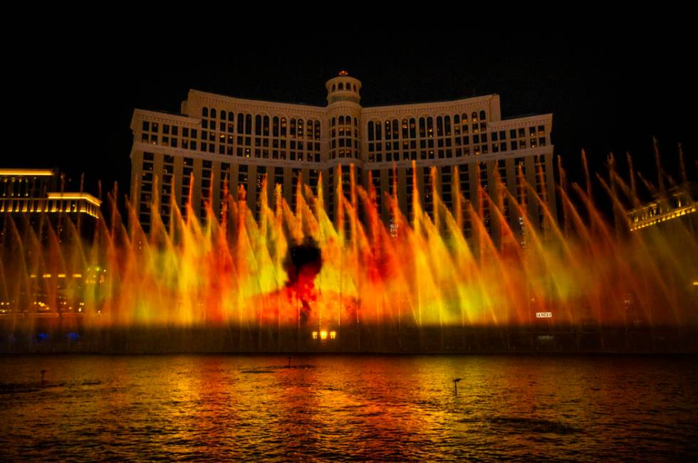 A man amongst flames during the debut of the new water show based on "Game of Thrones&quot ...