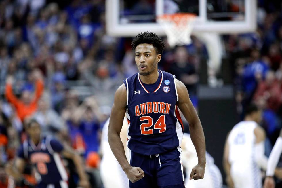 Auburn's Anfernee McLemore reacts after a score against Kentucky during the second half of the ...