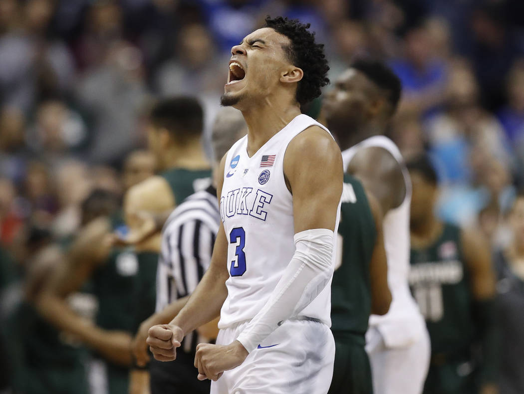 Duke guard Tre Jones (3) after his team scores against Michigan State during the second half of ...