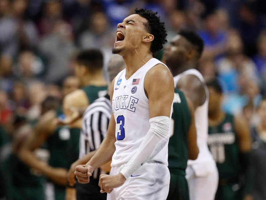 Duke guard Tre Jones (3) after his team scores against Michigan State during the second half of ...