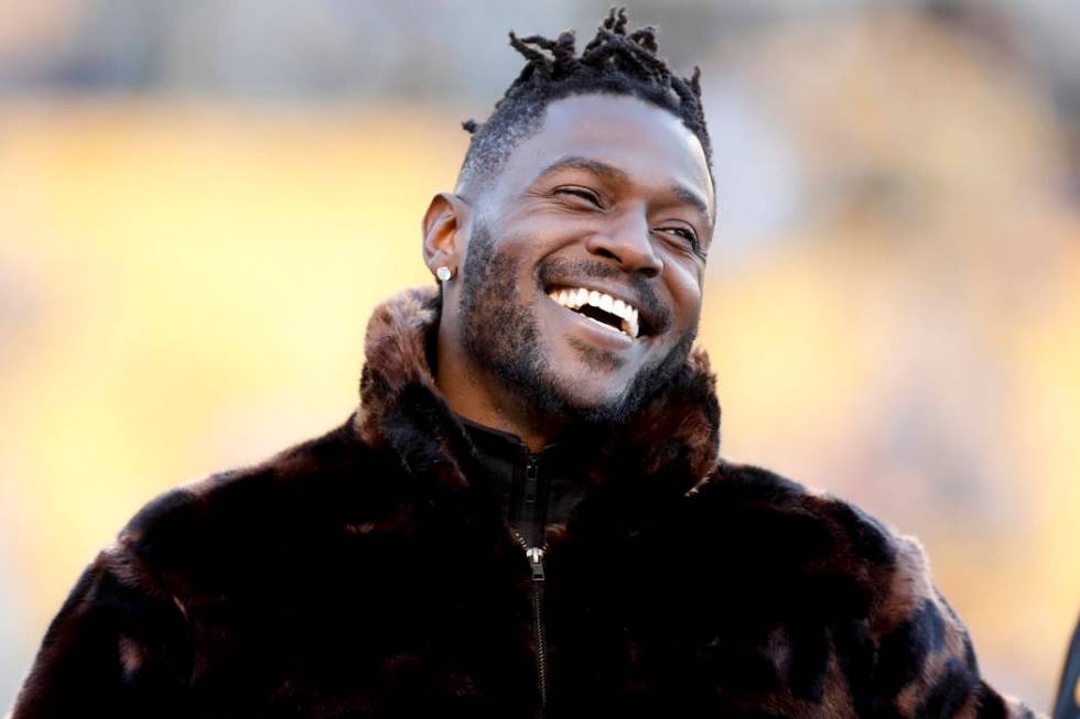 Pittsburgh Steelers wide receiver Antonio Brown stands along the sideline in street clothes bef ...