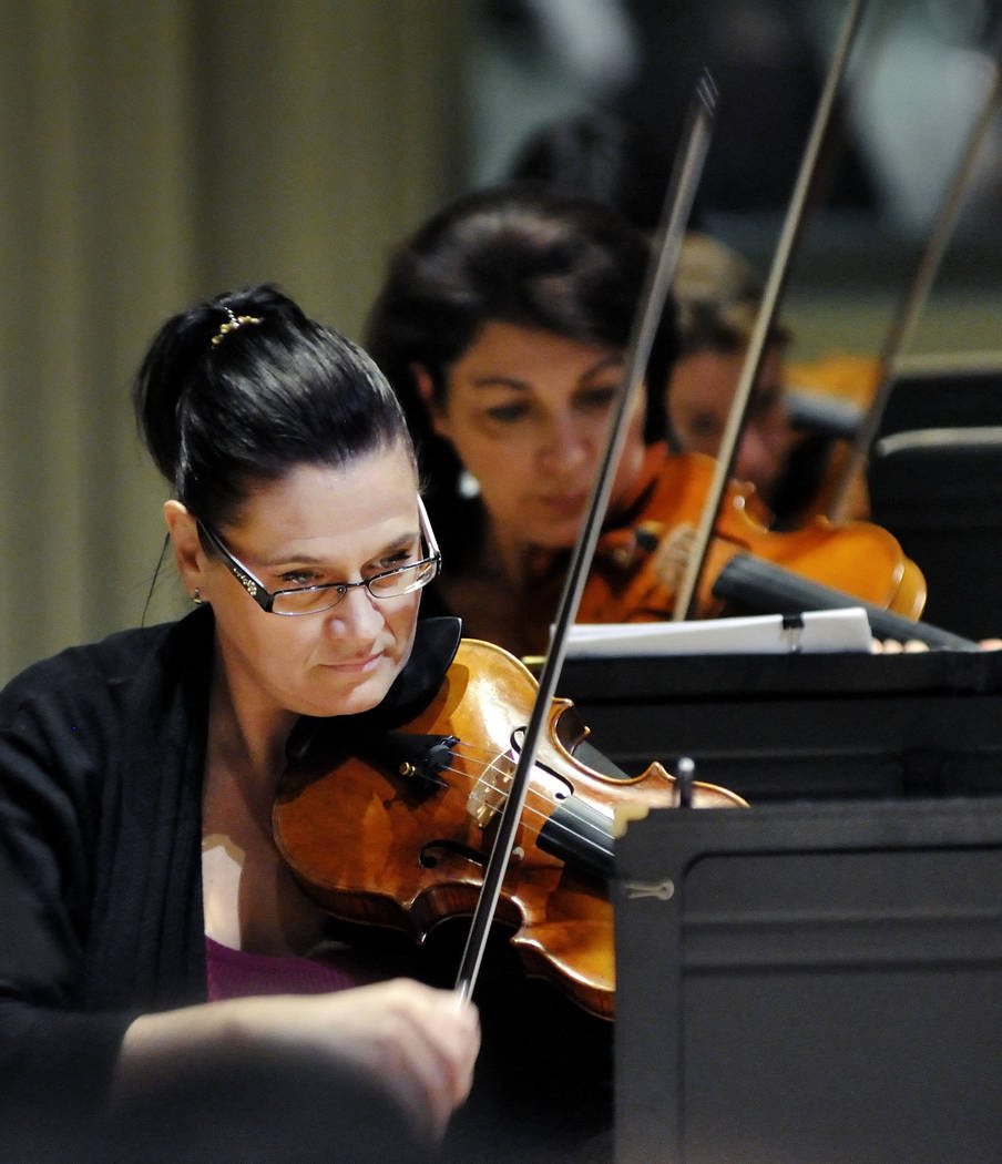 Concertmaster DeAnn Letourneau practices during a Las Vegas Philharmonic rehearsal in the Troes ...