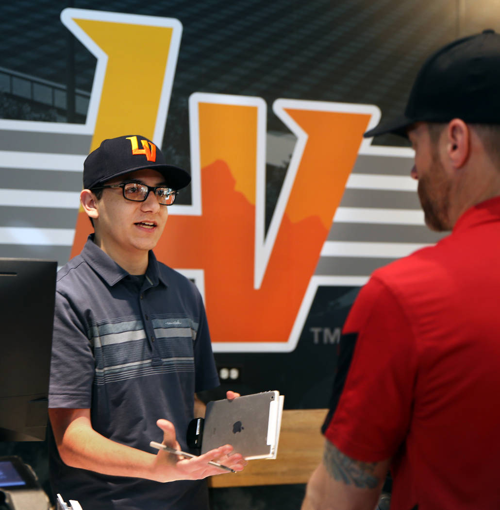 Employee Ian Karate with the Las Vegas Aviators sales office in Downtown Summerlin offers info ...