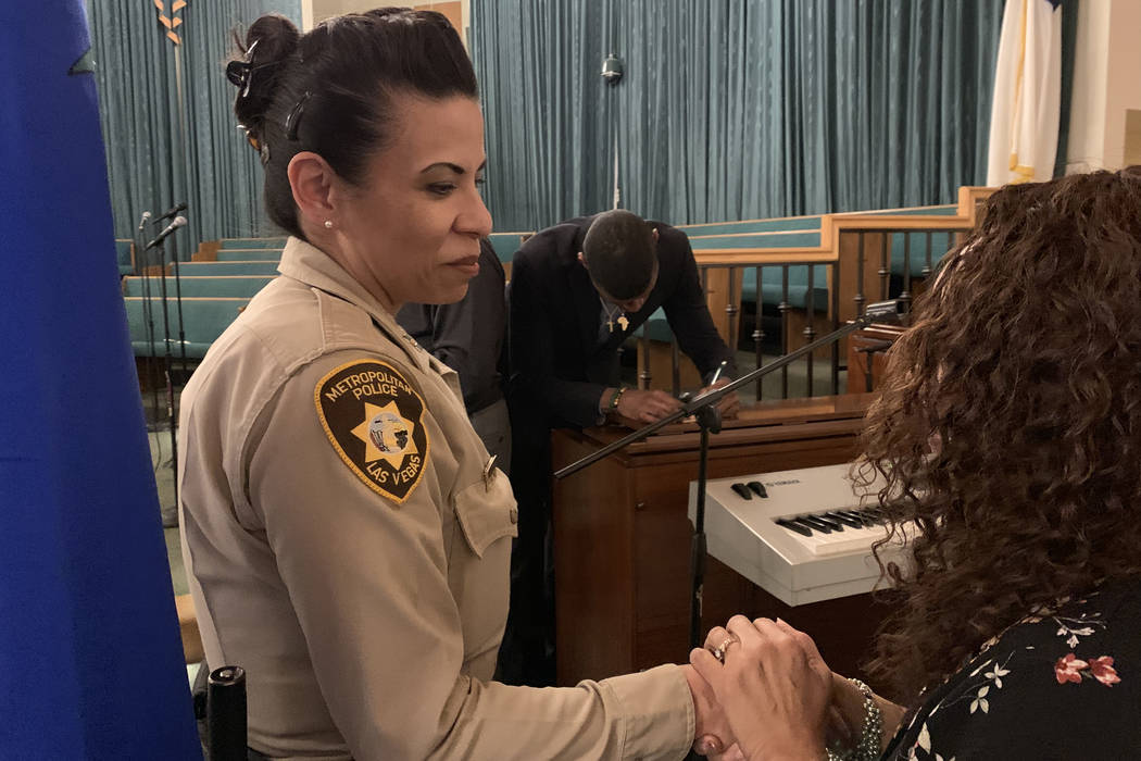 Metro police Capt. Yasenia Yatomi greets a resident at Blessing of the Badge, an event honoring ...