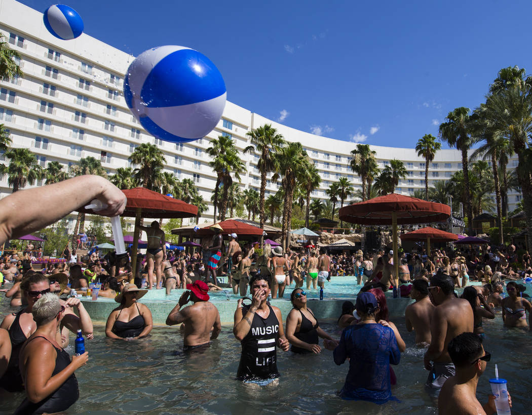 People enjoy the pool at the Rehab dayclub at Hard Rock Hotel in Las Vegas on Saturday, June 24 ...