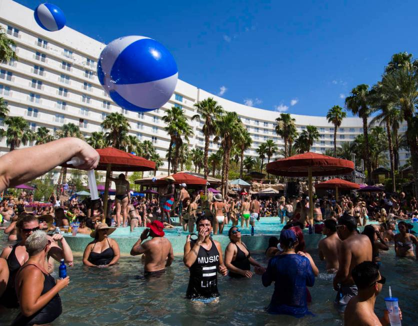 People enjoy the pool at the Rehab dayclub at Hard Rock Hotel in Las Vegas on Saturday, June 24 ...