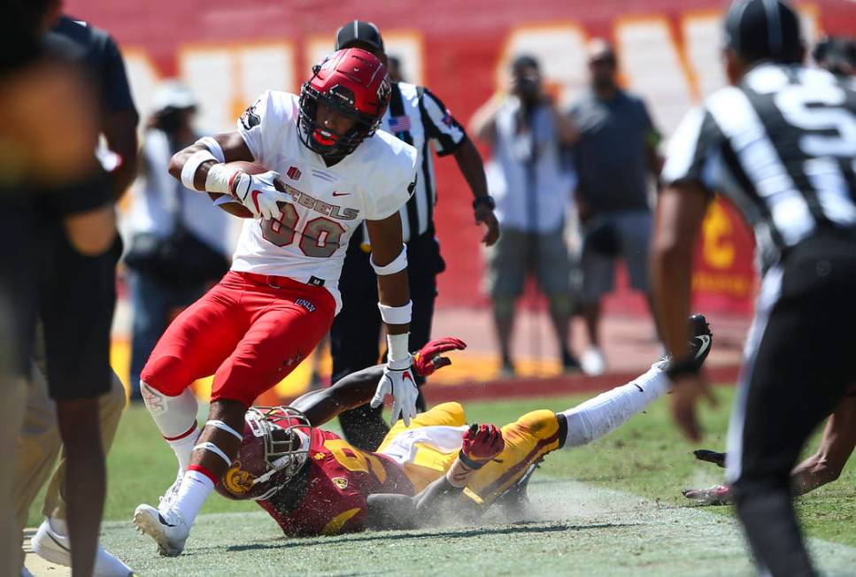 UNLV Rebels wide receiver Brandon Presley (80) is run out of bounds by USC Trojans cornerback G ...