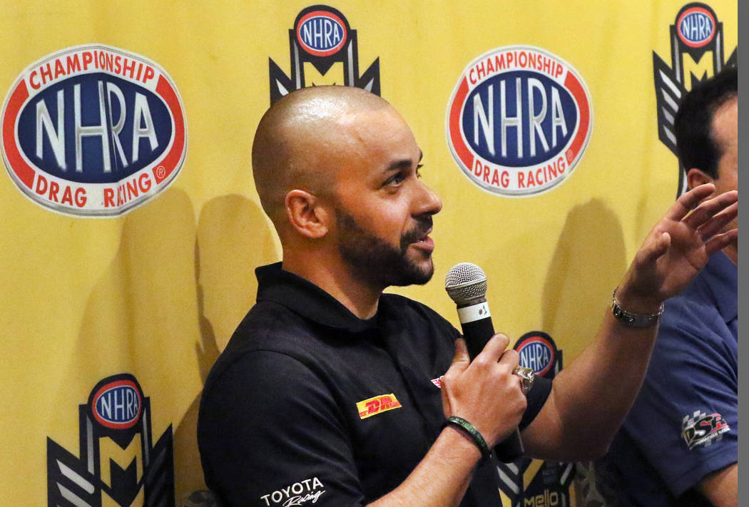 Funny Car driver JR Todd, left, speaks during a press conference on Thursday, April 4, 2019, in ...