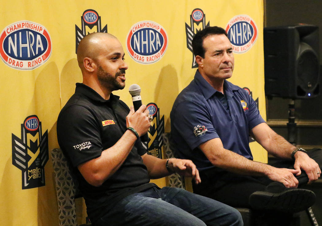 NHRA driver Ron Capps, right, listens as Funny Car driver JR Todd speaks during a press confere ...