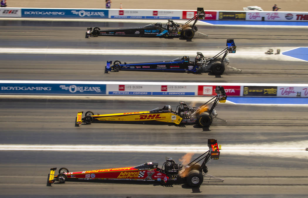 Top fuel cars race four across during the NHRA Mello Yellow Drag Racing Series on The Strip at ...