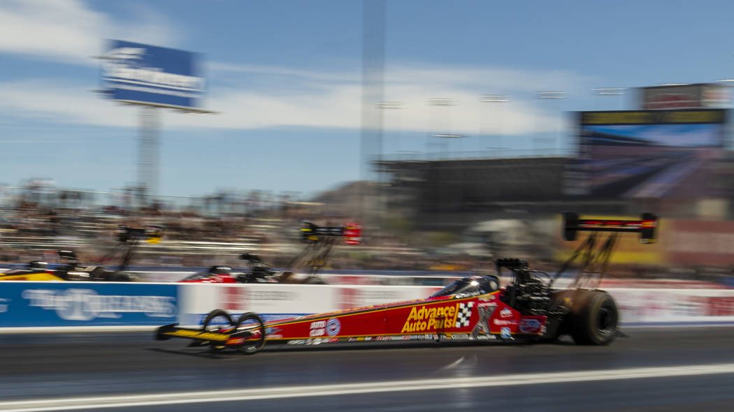Top Fuel racer Brittany Force blasts down the track during the NHRA Mello Yellow Drag Racing Se ...