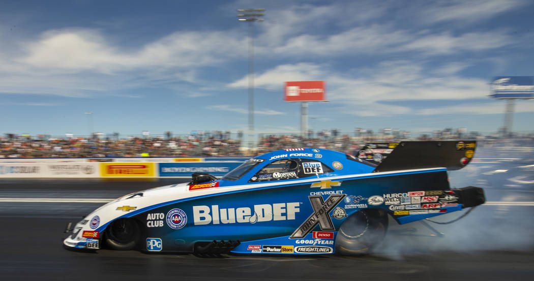 Funny Car racer John Force smokes the tires during the NHRA Mello Yellow Drag Racing Series on ...