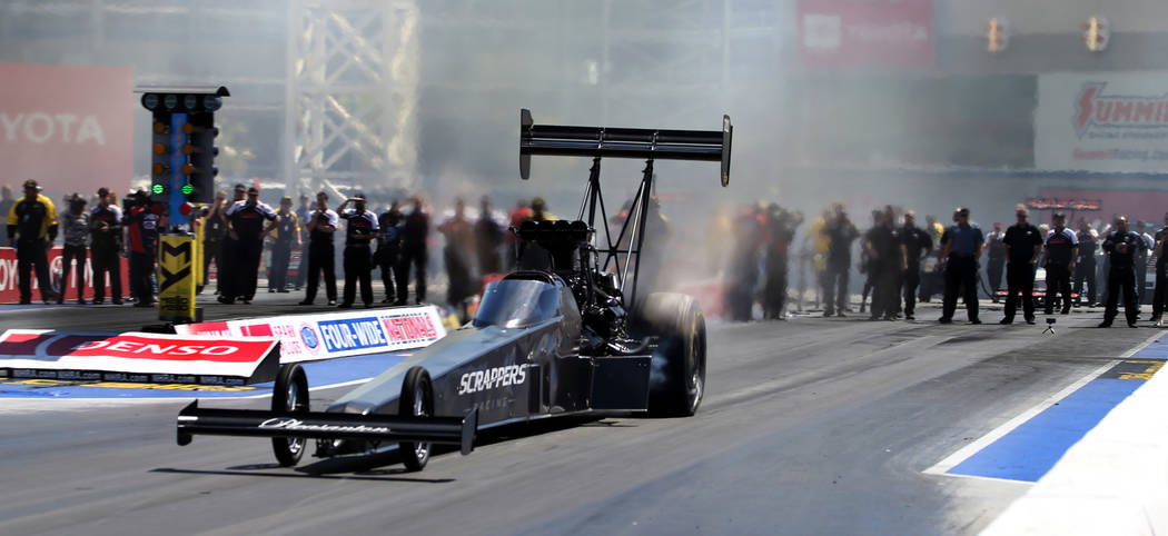 Top Fuel winner Mike Salinas leaves the start line during the NHRA Mello Yellow Drag Racing Ser ...