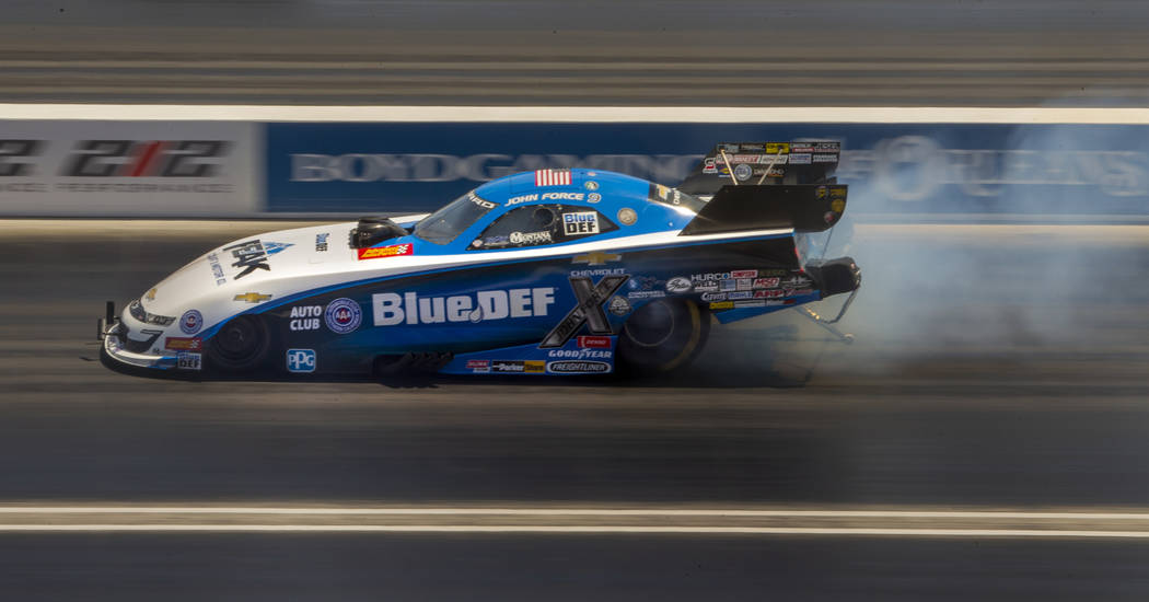 Funny Car racer John Force warms up the tires during the NHRA Mello Yellow Drag Racing Series o ...