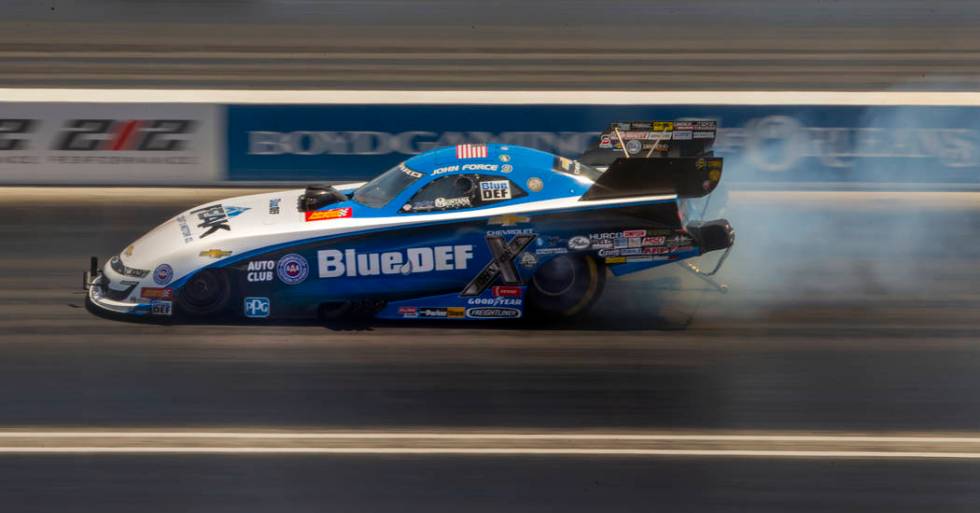 Funny Car racer John Force warms up the tires during the NHRA Mello Yellow Drag Racing Series o ...