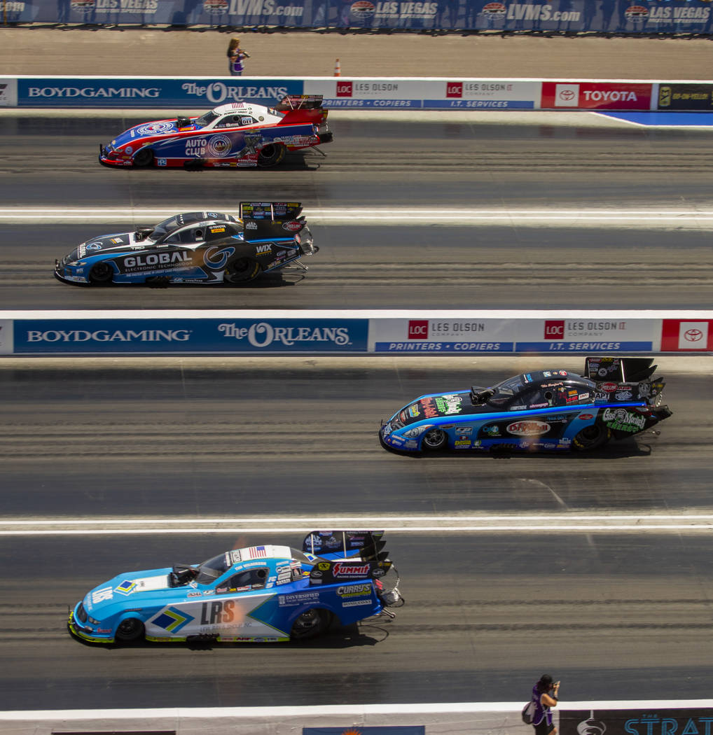 Funny Car racers compete four across during the NHRA Mello Yellow Drag Racing Series on The Str ...