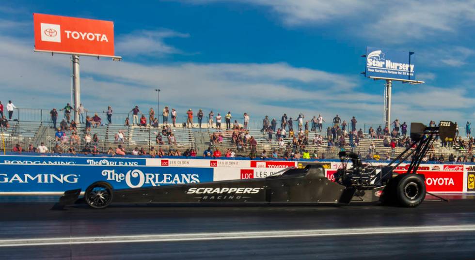 Top Fuel winner Mike Salinas cruises down the track to victory during the NHRA Mello Yellow Dra ...