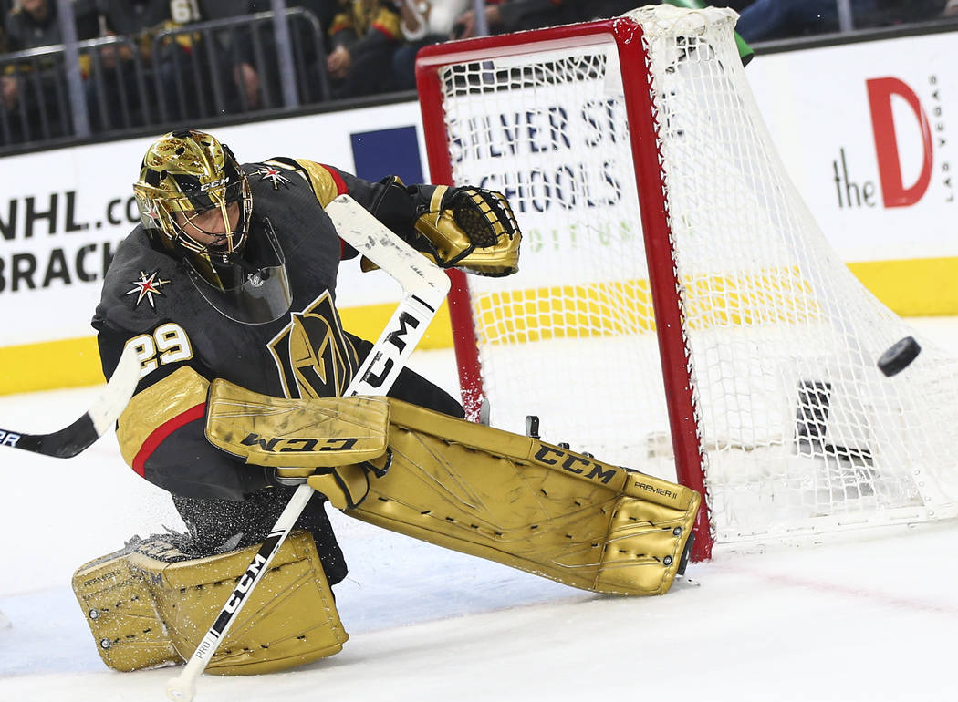 Golden Knights goaltender Marc-Andre Fleury (29) blocks a shot from the Arizona Coyotes during ...