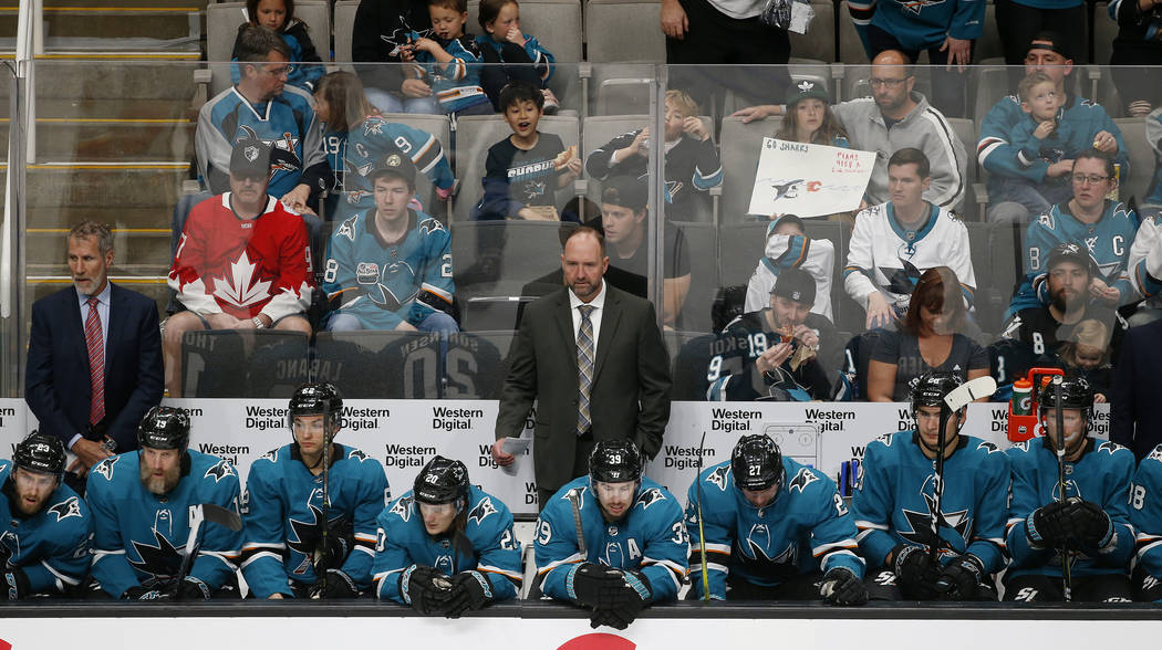 San Jose Sharks head coach Peter DeBoer watches the game from the bench against the Calgary Fla ...